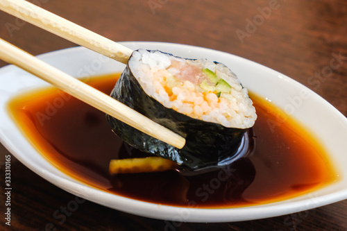 Bowl with tasty soy sauce a...