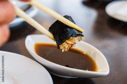 Bowl with tasty soy sauce a...