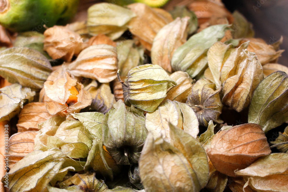 A view of a basket full of gooseberries on display at a local grocery store. A view of a basket full of gooseberries on display at a local grocery store.