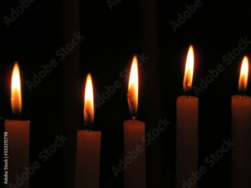 Beautiful photo of candles in a church lit for the feeling