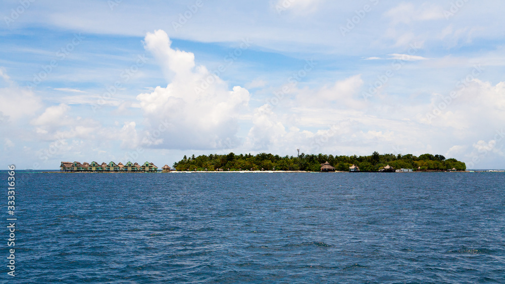 Blue coral sea and island panorama, Maldives