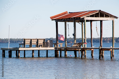 boat dock pier in perdido bay lillian alabama clear blue sky