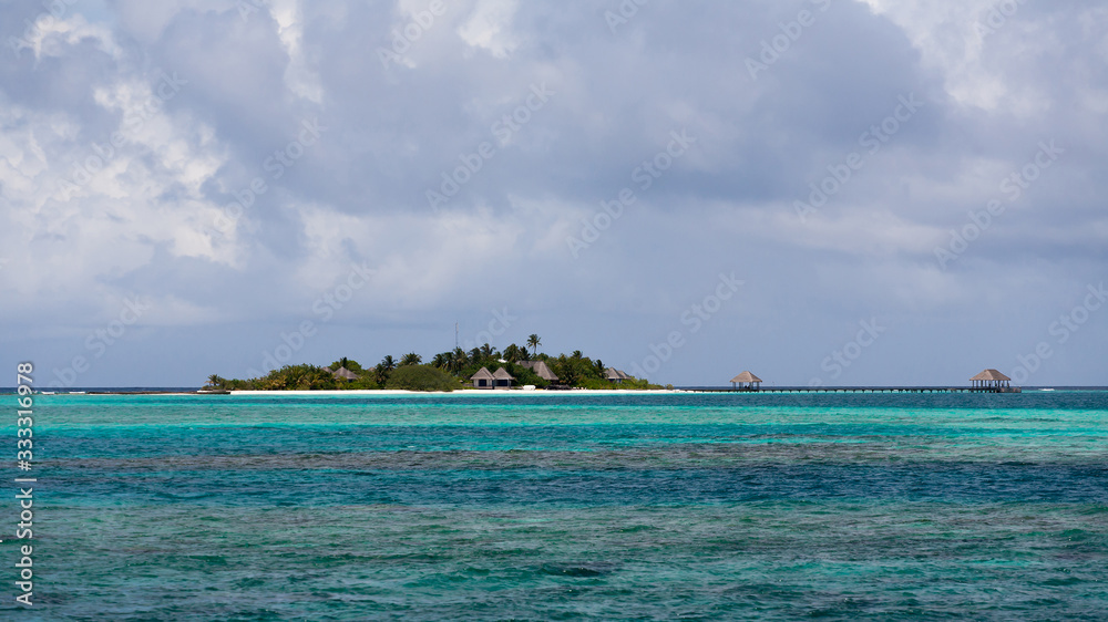 Blue coral sea and island panorama, Maldives