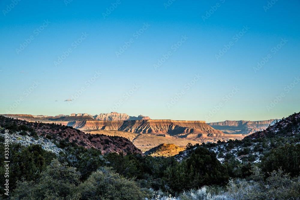 Looking out from the Pine Valley Mountains toward Zion National Park skyline in the distance.