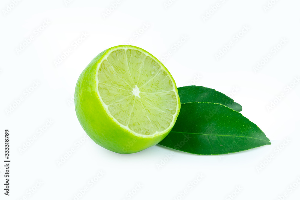 Lime with slices half and leaves isolated on white background. Green citrus fruit. with clipping path Lime with slices half and leaves isolated on white background. Green citrus fruit. with clipping path