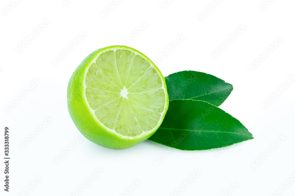 Lime with slices half and leaves isolated on white background. Green citrus fruit. with clipping path Lime with slices half and leaves isolated on white background. Green citrus fruit. with clipping path