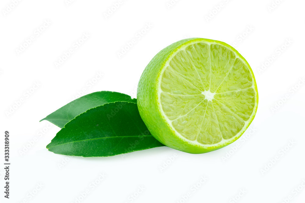 Lime with slices half and leaves isolated on white background. Green citrus fruit. with clipping path Lime with slices half and leaves isolated on white background. Green citrus fruit. with clipping path
