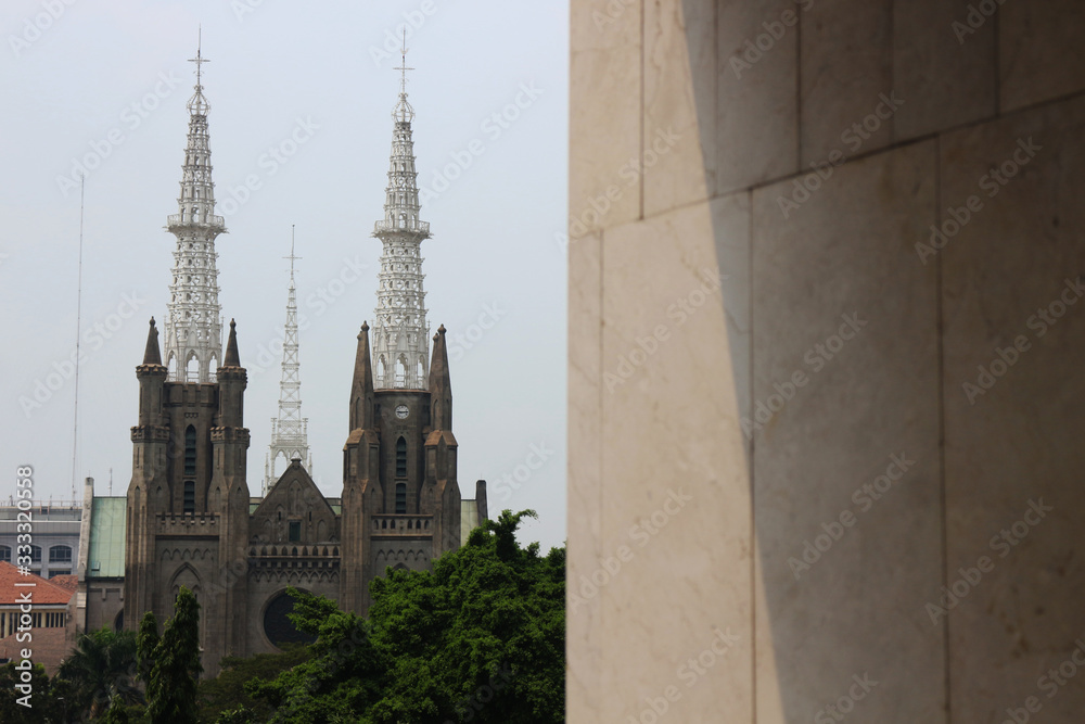 Jakarta Katredal Church is a place of worship for Christians, opposite the Istiqlal Mosque - view from Istiqlal Mosque