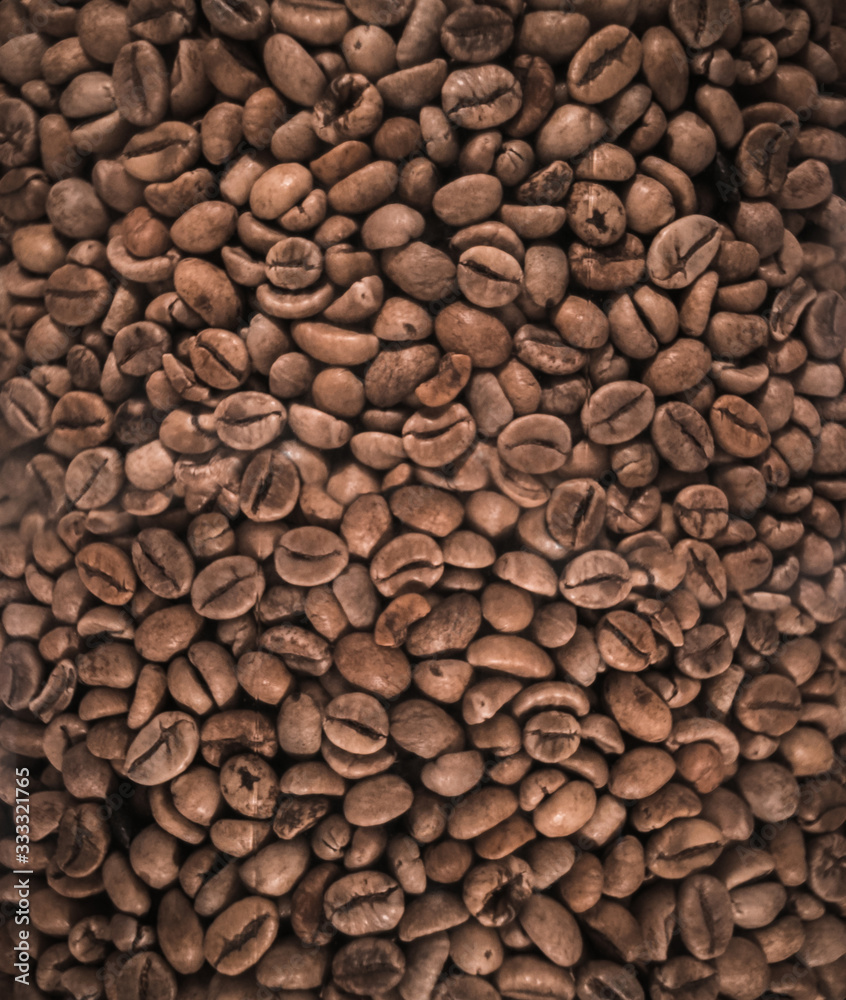 Closeup roasted coffee beans background Closeup roasted coffee beans background