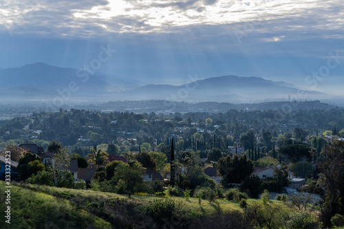 Morning sunbeams and strom clouds above the San Fernando Valley area of Los Angeles in Southern California. 