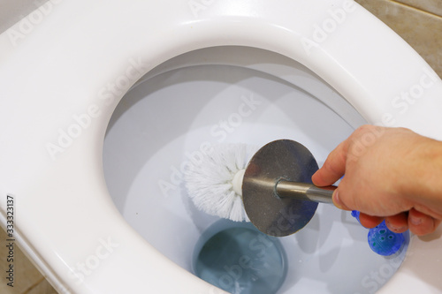 Cleaning your home toilet from limestone and rust