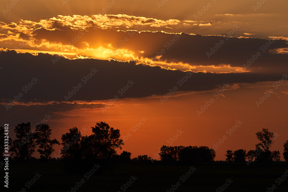 Fototapeta premium Beautiful sunset with orange clouds
