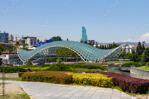 July 4, 2019 - Tbilisi, Georgia - The Bridge of Peace is a pedestrian bridge spanning the Kura River between Old Tbilisi and the new district