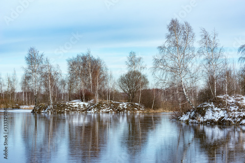 Melting ice on the lake at winter day time. © serjiob74