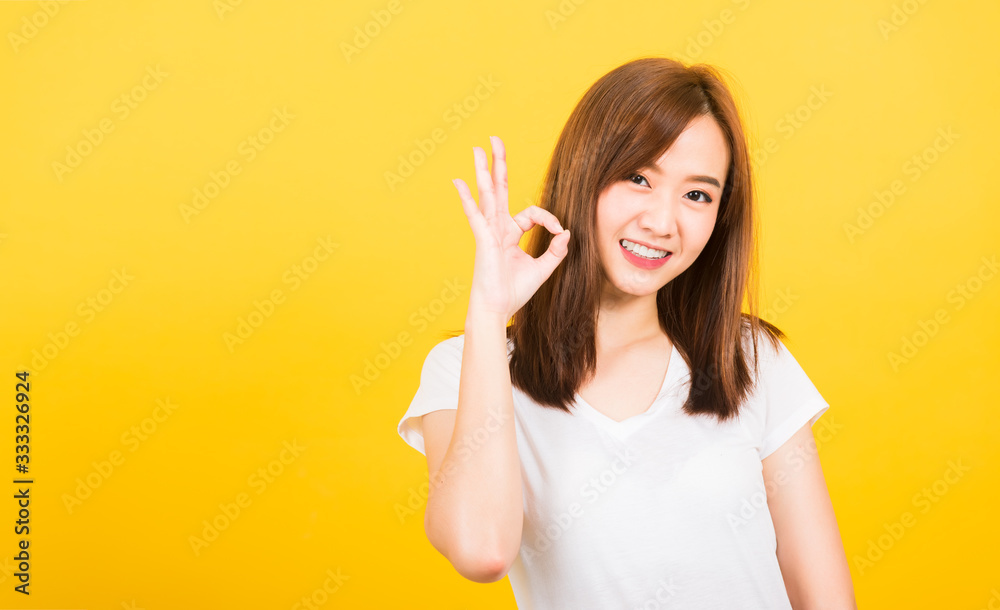 woman teen standing wear t-shirt showing gesturing ok sign woman teen standing wear t-shirt showing gesturing ok sign