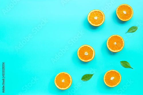 High vitamin C, Juicy and sweet. Fresh orange fruit  on blue background.