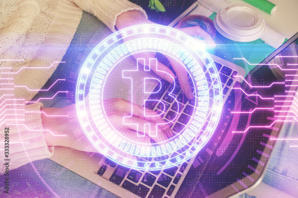 Double exposure of woman hands typing on computer and crypto market theme hologram drawing. Blockchain concept. Double exposure of woman hands typing on computer and crypto market theme hologram drawing. Blockchain concept.