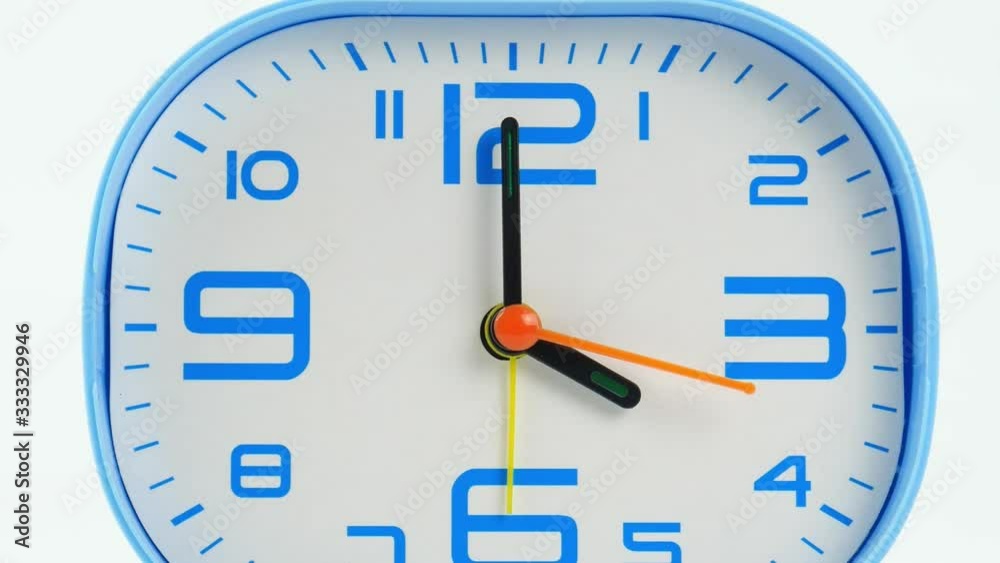 Close up Move the camera, Blue Alarm clock face beginning of time 04.00 am or pm. on white background. Close up Move the camera, Blue Alarm clock face beginning of time 04.00 am or pm. on white background.