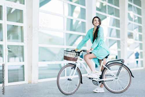 Business woman riding her urban bicycle
