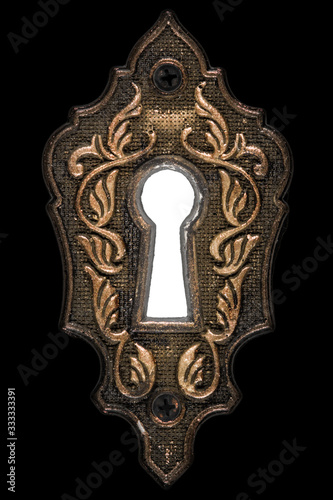 Bright light in the keyhole, decorative design element, isolated on black background