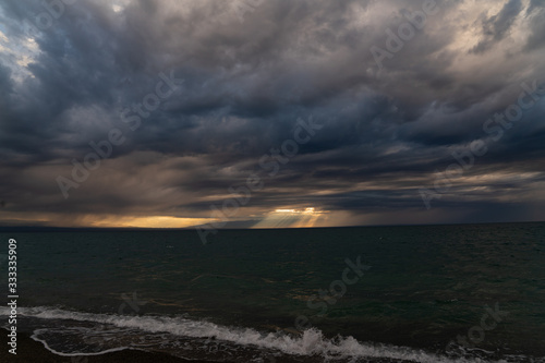 sunset on a lake in Mongolia storm sky