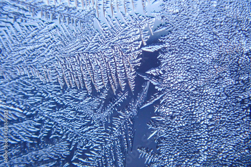 macro ice on the glass in winter Patterned like leaves	