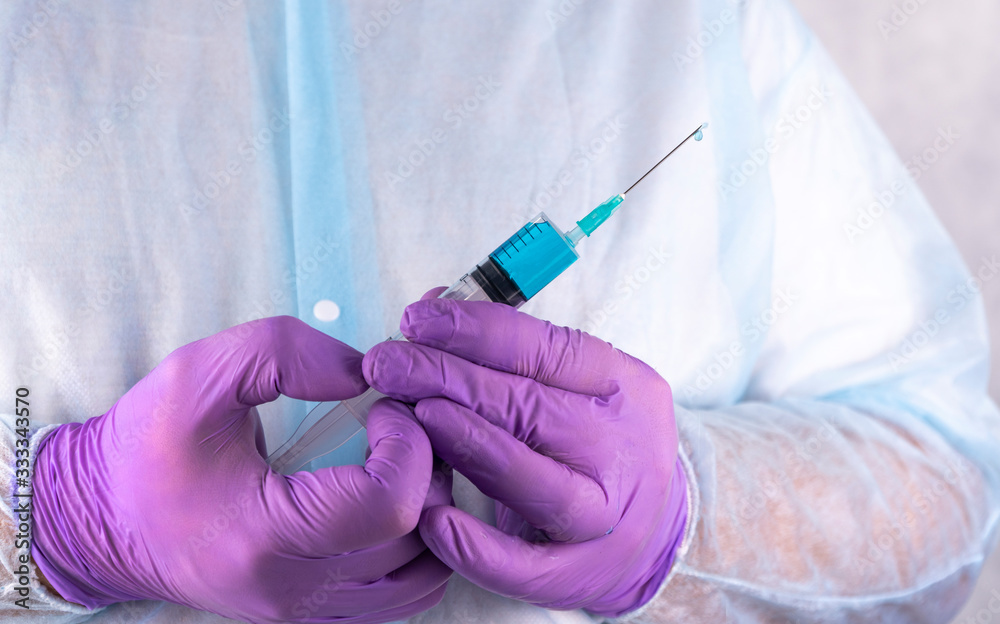 cure from coronavirus. Doctor hand in gloves holding flu, measles, COVID-19 vaccine shot.
