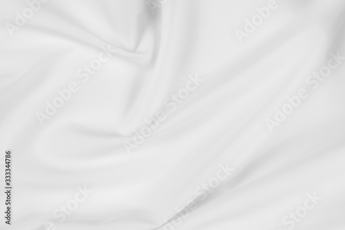 Abstract white fabric texture background. Cloth soft wave. Creases of satin, silk, and cotton.