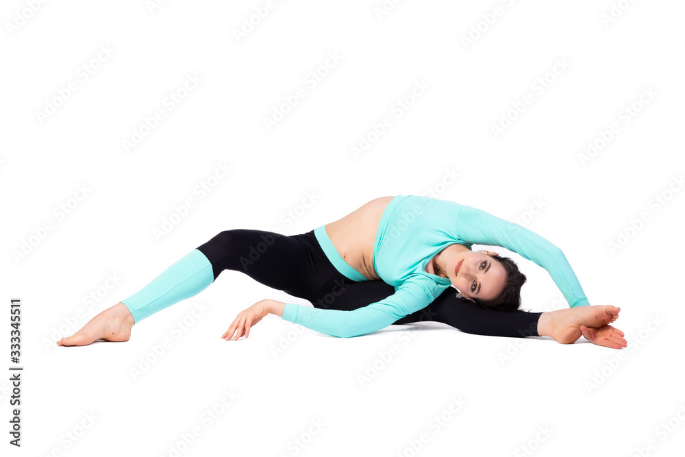 Beautiful woman gymnast in a tight fit tights doing twins and smiling on a bright white isolated background. The concept of gymnasts and sports stretching, oriental relaxation practices Beautiful woman gymnast in a tight fit tights doing twins and smiling on a bright white isolated background. The concept of gymnasts and sports stretching, oriental relaxation practices