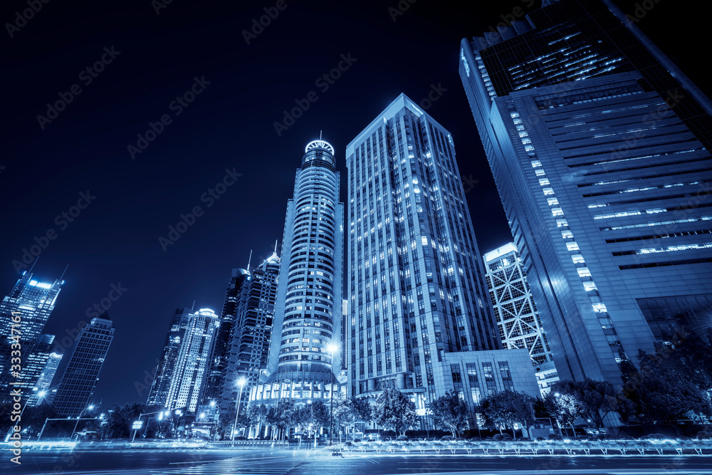 Obraz premium Night view of architectural street in Lujiazui Financial District, Shanghai..