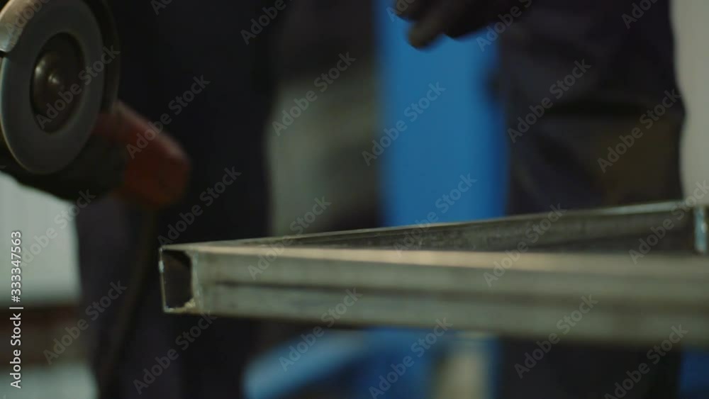 Industry Worker Grinding Metal with Angle Grinder Industry Worker Grinding Metal with Angle Grinder