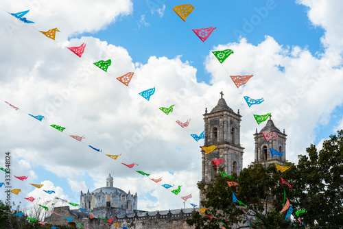 Mexican decorative banners and top structure of Cathedral in Valladolid, Yucatán, México