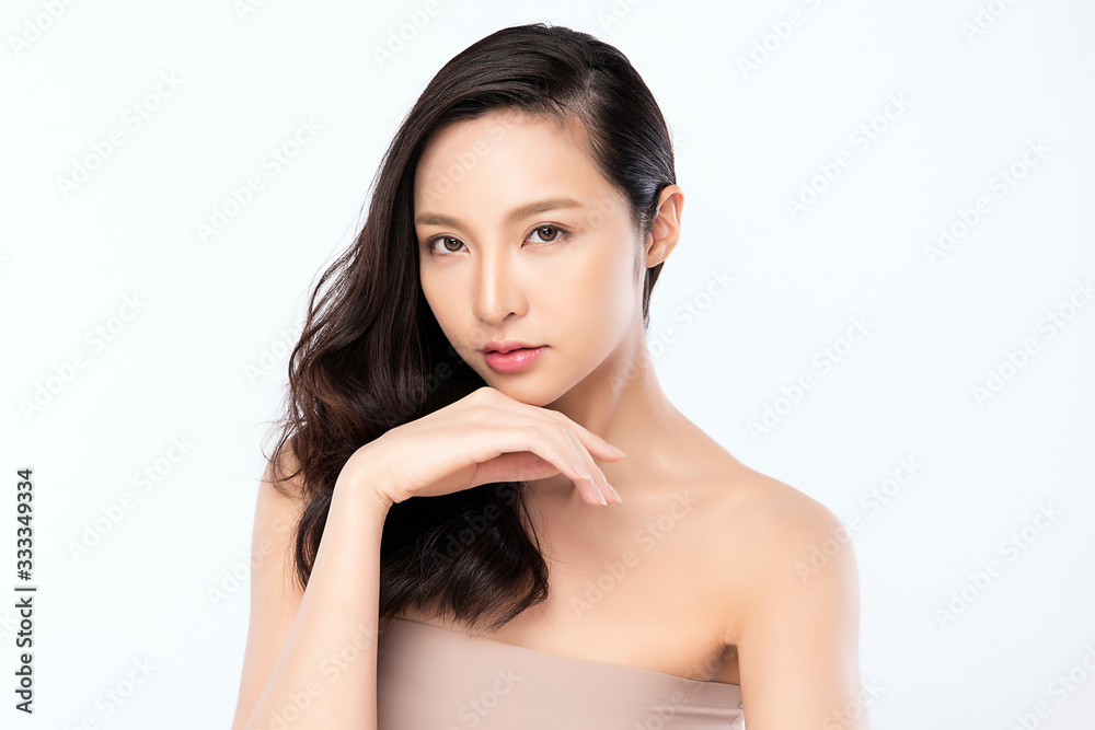 Beautiful Young Asian Woman with Clean Fresh Skin. Face care, Facial treatment, Cosmetology, beauty and healthy skin and cosmetic concept, woman beauty skin isolated on white background Beautiful Young Asian Woman with Clean Fresh Skin. Face care, Facial treatment, Cosmetology, beauty and healthy skin and cosmetic concept, woman beauty skin isolated on white background