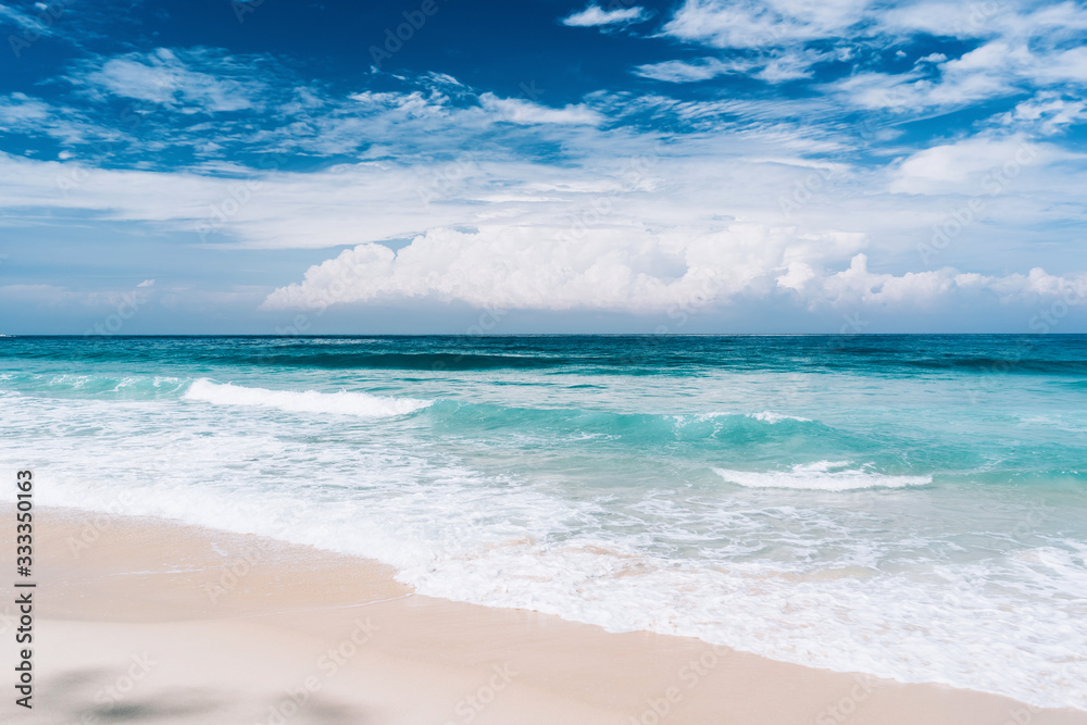 Beautiful tropical beach with blue sky and white clouds abstract texture background. Copy space of summer vacation and holiday business travel concept. Beautiful tropical beach with blue sky and white clouds abstract texture background. Copy space of summer vacation and holiday business travel concept.