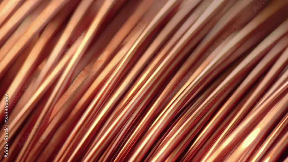 Close up of the bare bright copper wire on the spool Close up of the bare bright copper wire on the spool