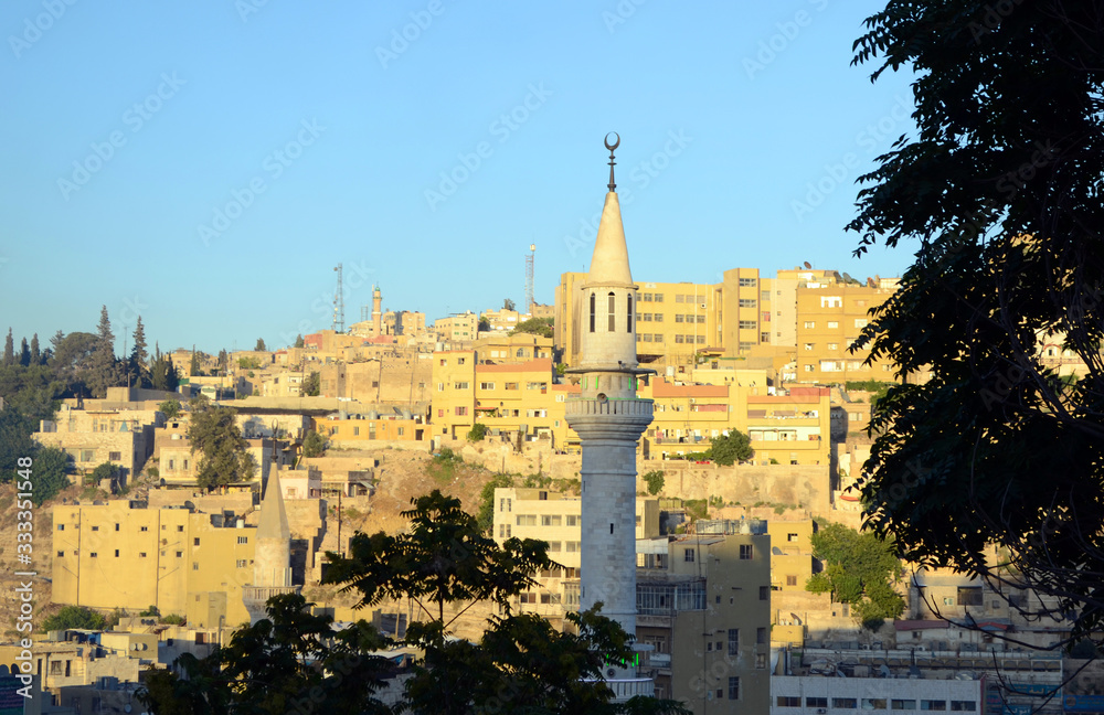 Minaret with central Amman's skyline in the background