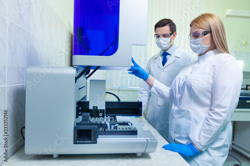A group of scientists conducts research in a scientific laboratory using advanced technology.