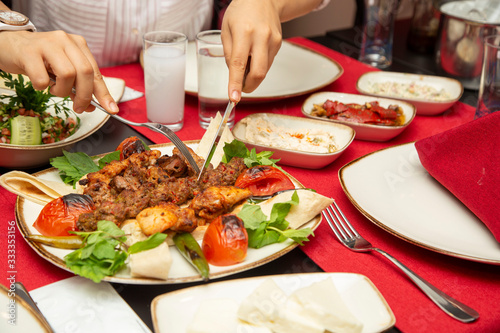 dinner men   with traditional drink raki 