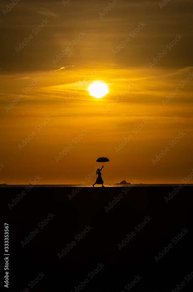 silhouette of man at sunset