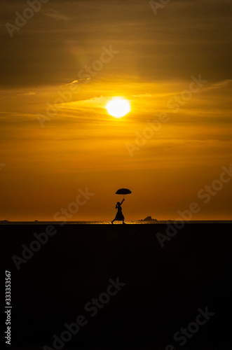 silhouette of man at sunset © 義一 柳本