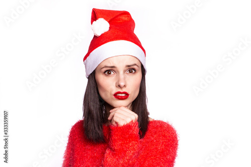 beautiful girl in santaclaus hat and red sweater  red lips