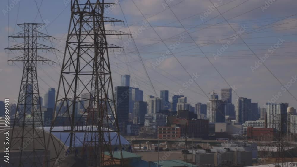 Main Electric Arcs With Wires Connected To Different Poles And The Skyscrapers As A Background. -wide shot Main Electric Arcs With Wires Connected To Different Poles And The Skyscrapers As A Background. -wide shot