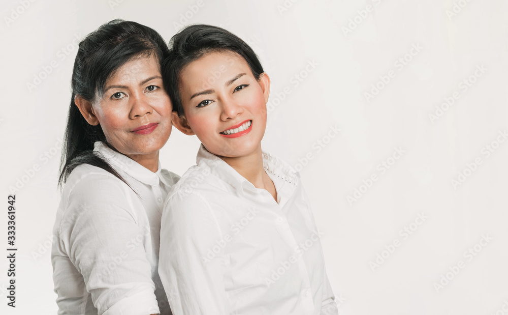 The happiness of an Asian mother whose daughter is hugging her The happiness of an Asian mother whose daughter is hugging her