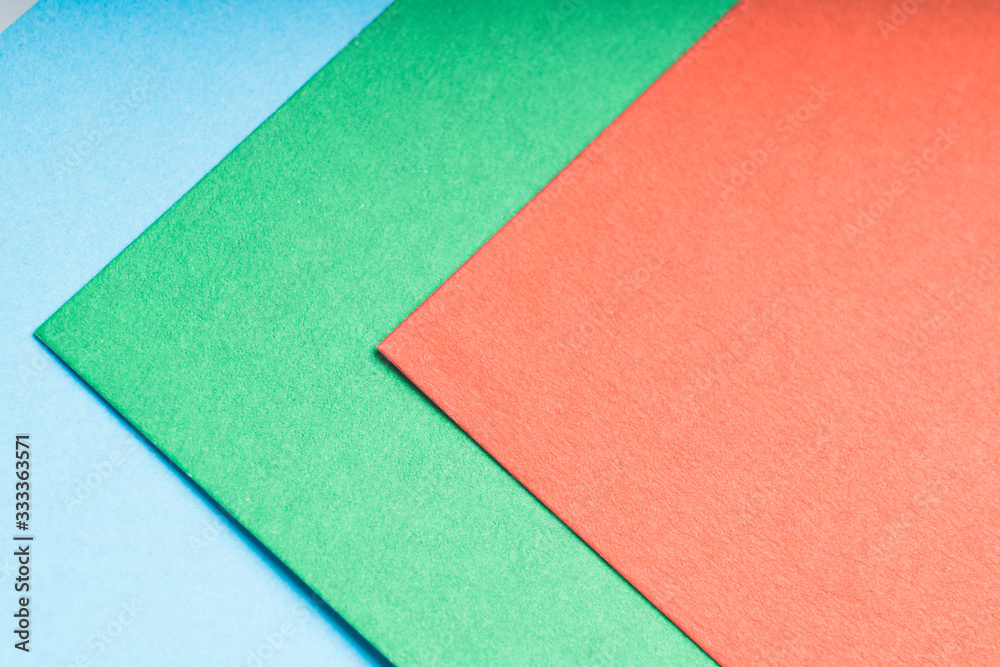 multi-colored sheets of paper , abstract background, tinted image, selective focus multi-colored sheets of paper , abstract background, tinted image, selective focus