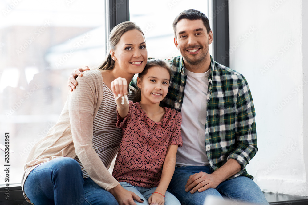mortgage, family and real estate concept - happy mother, father and little daughter with house keys moving to new home mortgage, family and real estate concept - happy mother, father and little daughter with house keys moving to new home