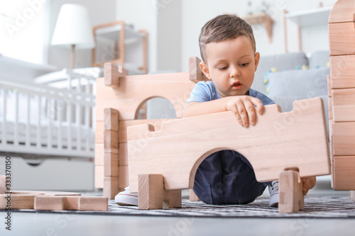 Little boy playing with tak...