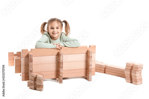 Little girl playing with ta...