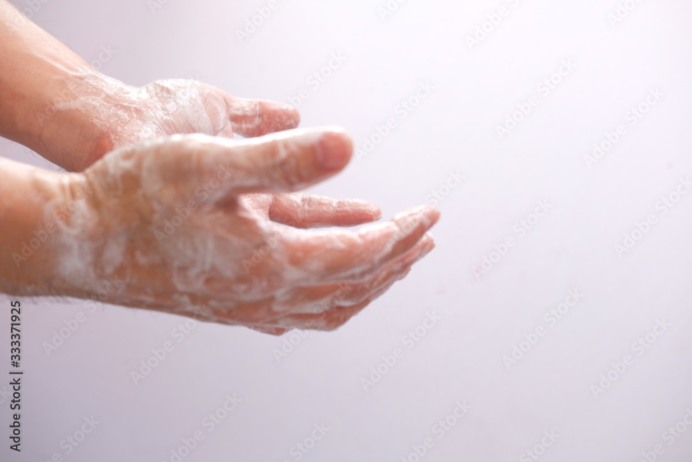 washing hands with liquid soap and sponge