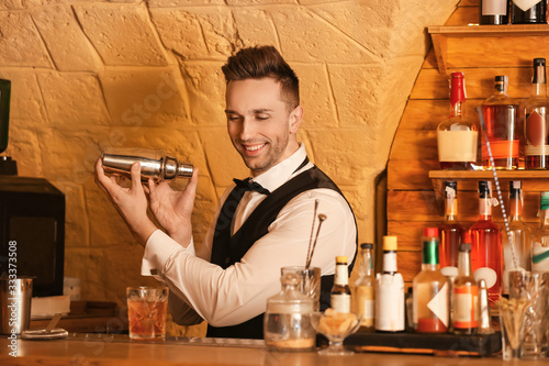 Male bartender making cockt...
