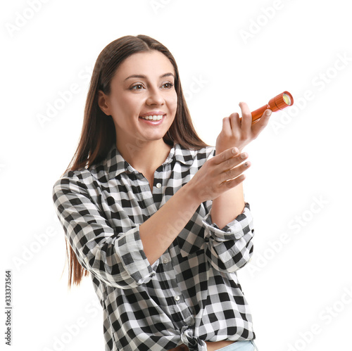 Woman with flashlight on wh...